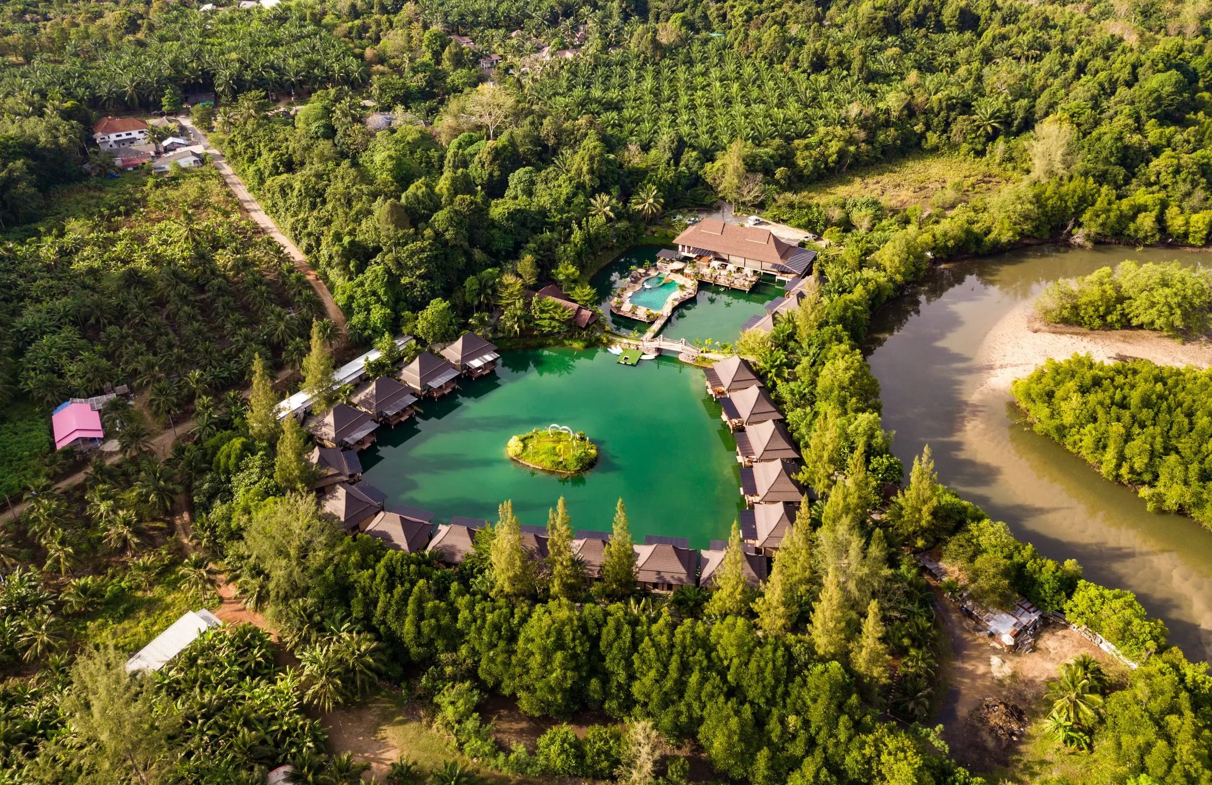 Aerial view of a resort surrounded by jungle